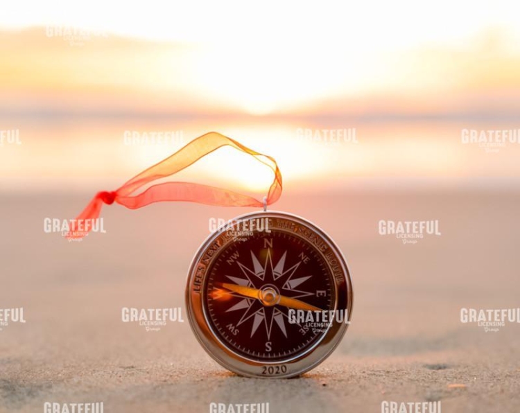 Compass on beach