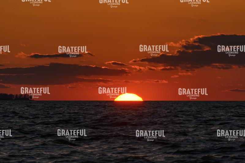 As The Sun Sinks Into The Lake