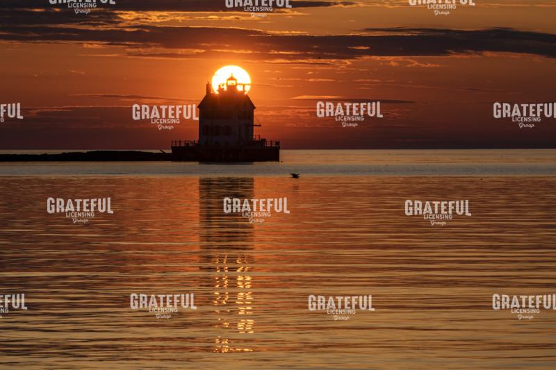 Lighthouse Sunset Reflections