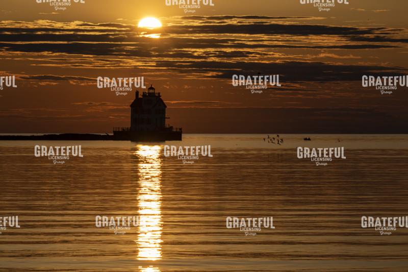 Sun Setting Over Lorain lighthouse