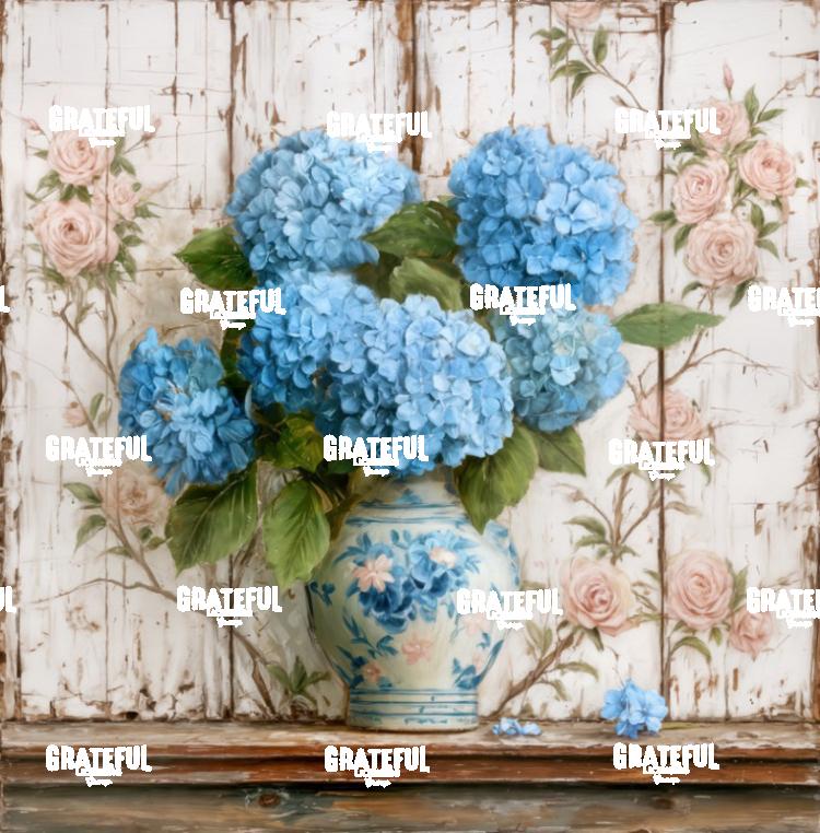 Blue Hydrangeas on a Shelf with Painted Rose Wall