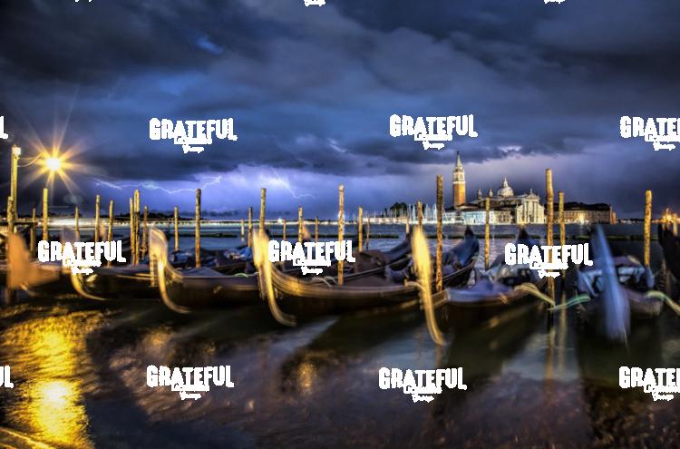 Gondolas and lightning in Venice Italy