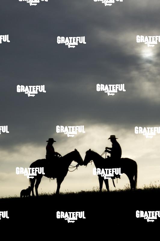 Cowboy and Cowgirl at Sunset