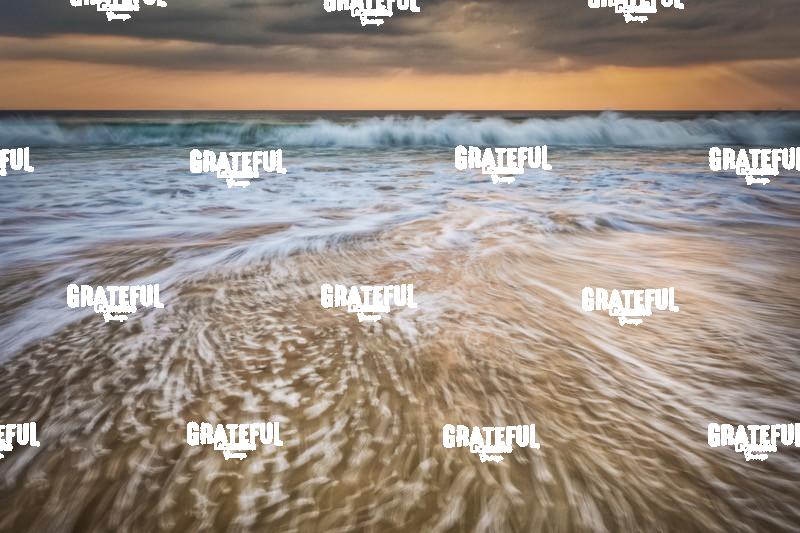 Sunset and waves crashing off the coast of Burma 2