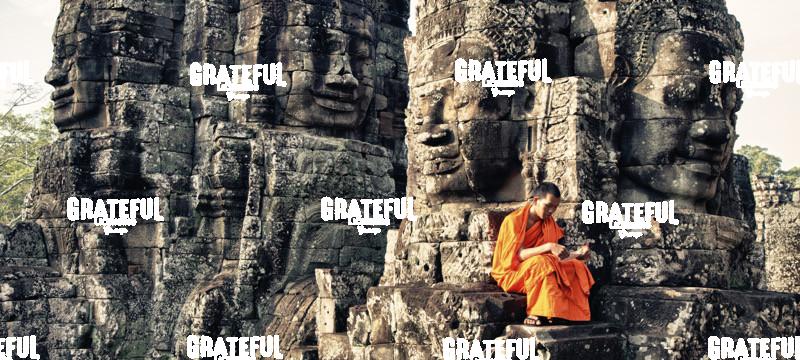 Monk reading in the Bayon of Angkor Wat Temple