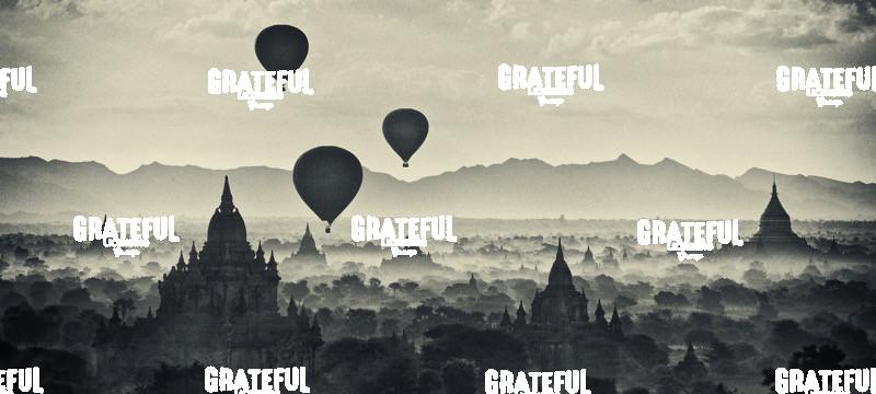 Hot air balloons floating above the temples of Pagan, Myanmar at sunrise