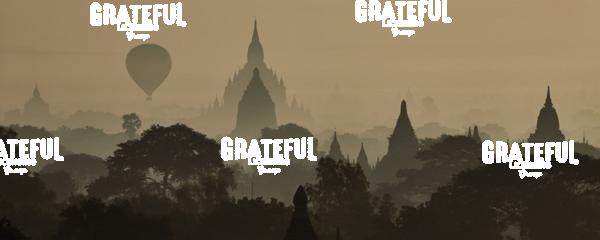 Hot air balloons floating above the temples of Bagan, Myanmar at sunrise