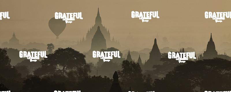 Hot air balloons floating above the temples of Bagan, Myanmar at sunrise