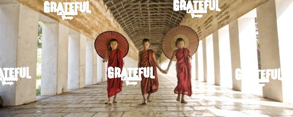 Monks with parasols in Mandalay, Burma 3