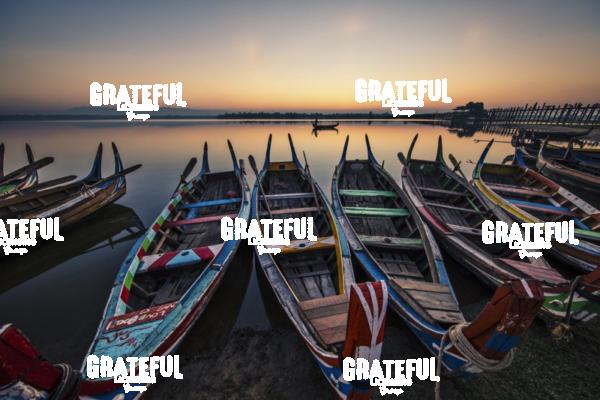 Colorful Longtail Boats at Sunrise at the Ubein Bridge in Mandalay, Burma