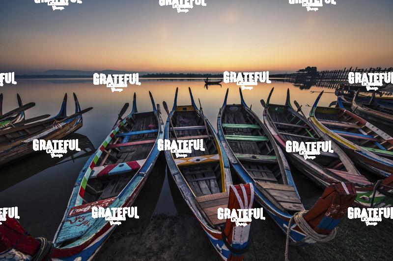 Colorful Longtail Boats at Sunrise at the Ubein Bridge in Mandalay, Burma