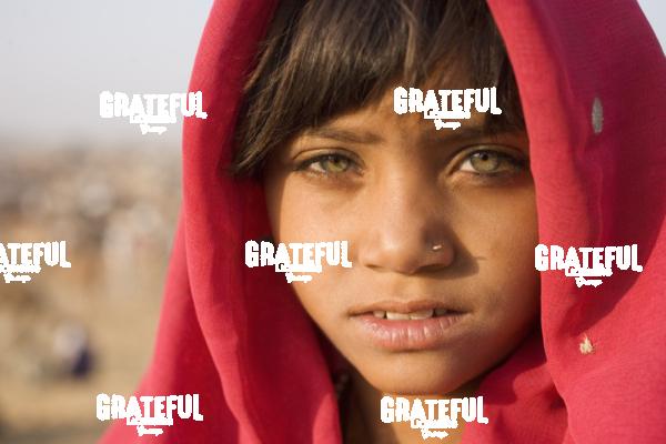 girl with scarf at the pushkar camel festival in India