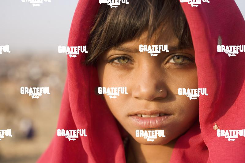 girl with scarf at the pushkar camel festival in India