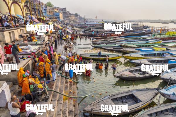 Longtail boats and people praying, Varinasi, India