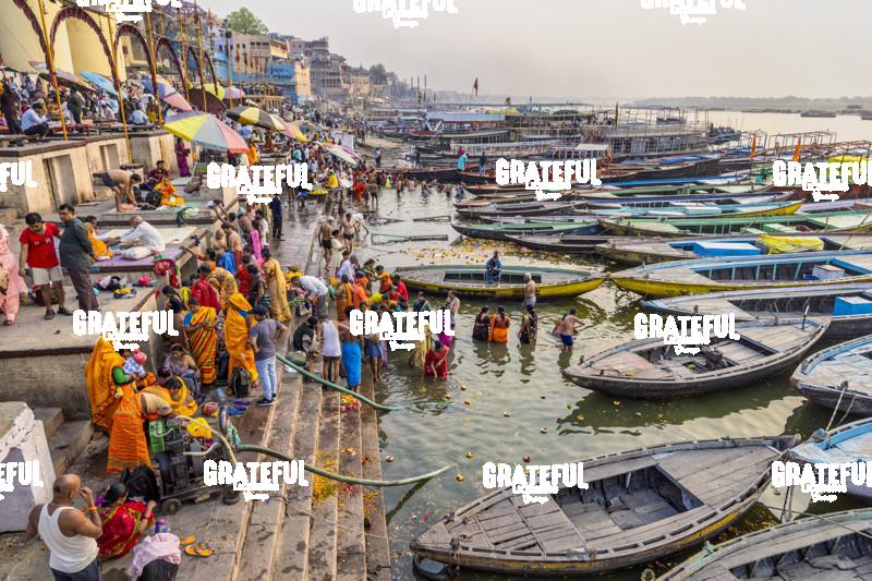Longtail boats and people praying, Varinasi, India