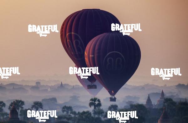 Hot air balloons over the temples of Bagan, Burma at sunrise