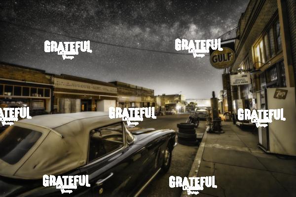 Erie Street in Bisbee, Arizona with classic cars and the Milky Way