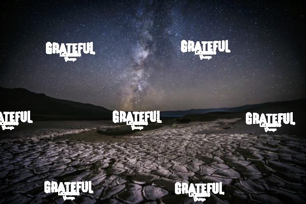 The Milky Way over cracked earth in Death Valley