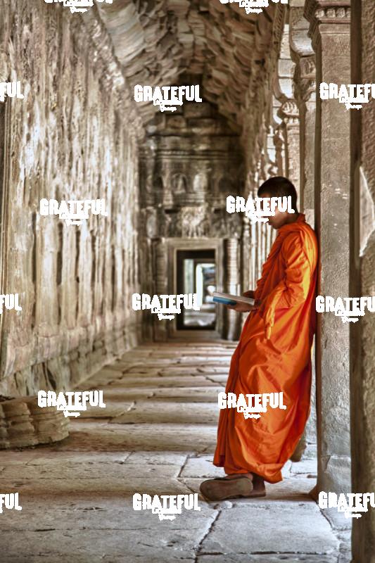 monk praying in Angkor Wat temple 2